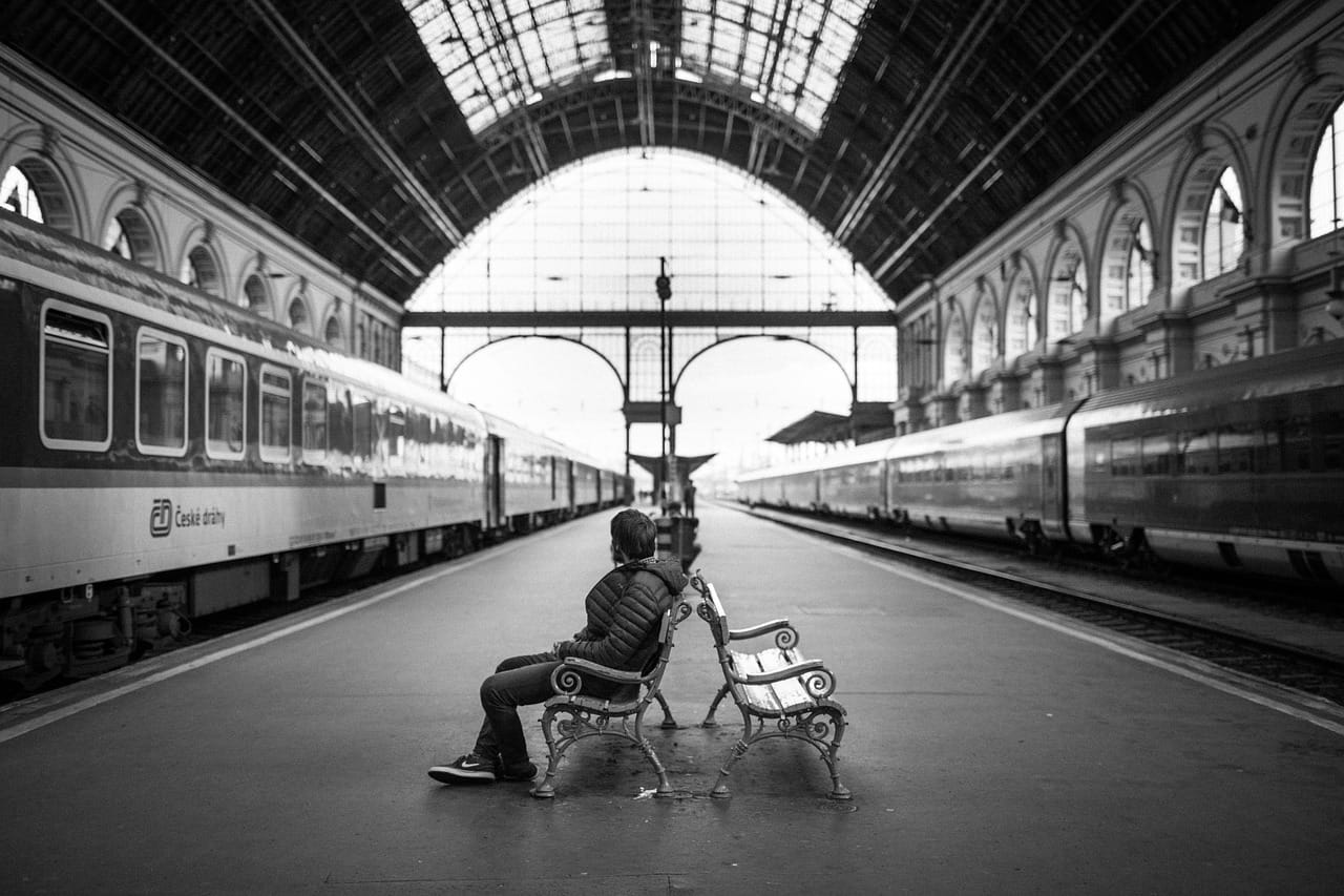 On the platform and on the train, engine noise drops to a soft hum.