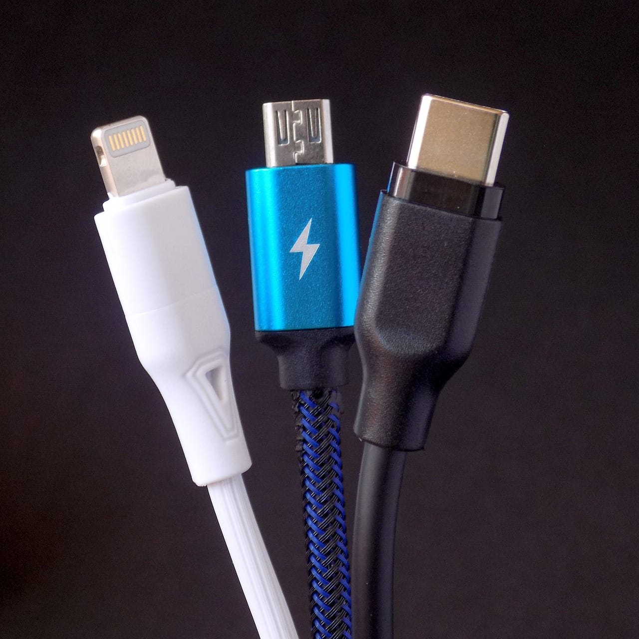 Three cables, three plugs. USB-C, on the right, was meant to replace the other two.